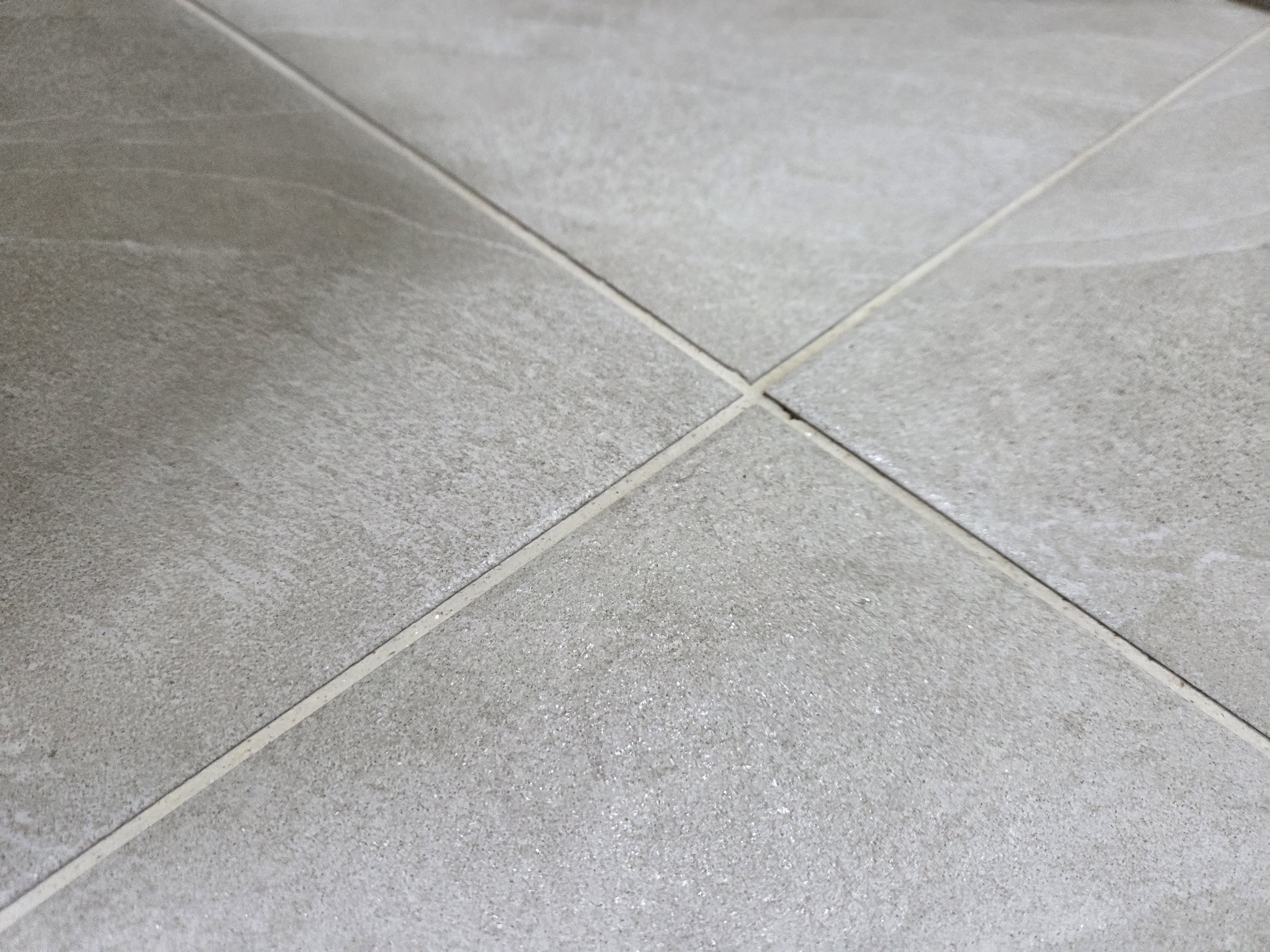 Close view of clean ceramic tile with clearly visible restored grout lines